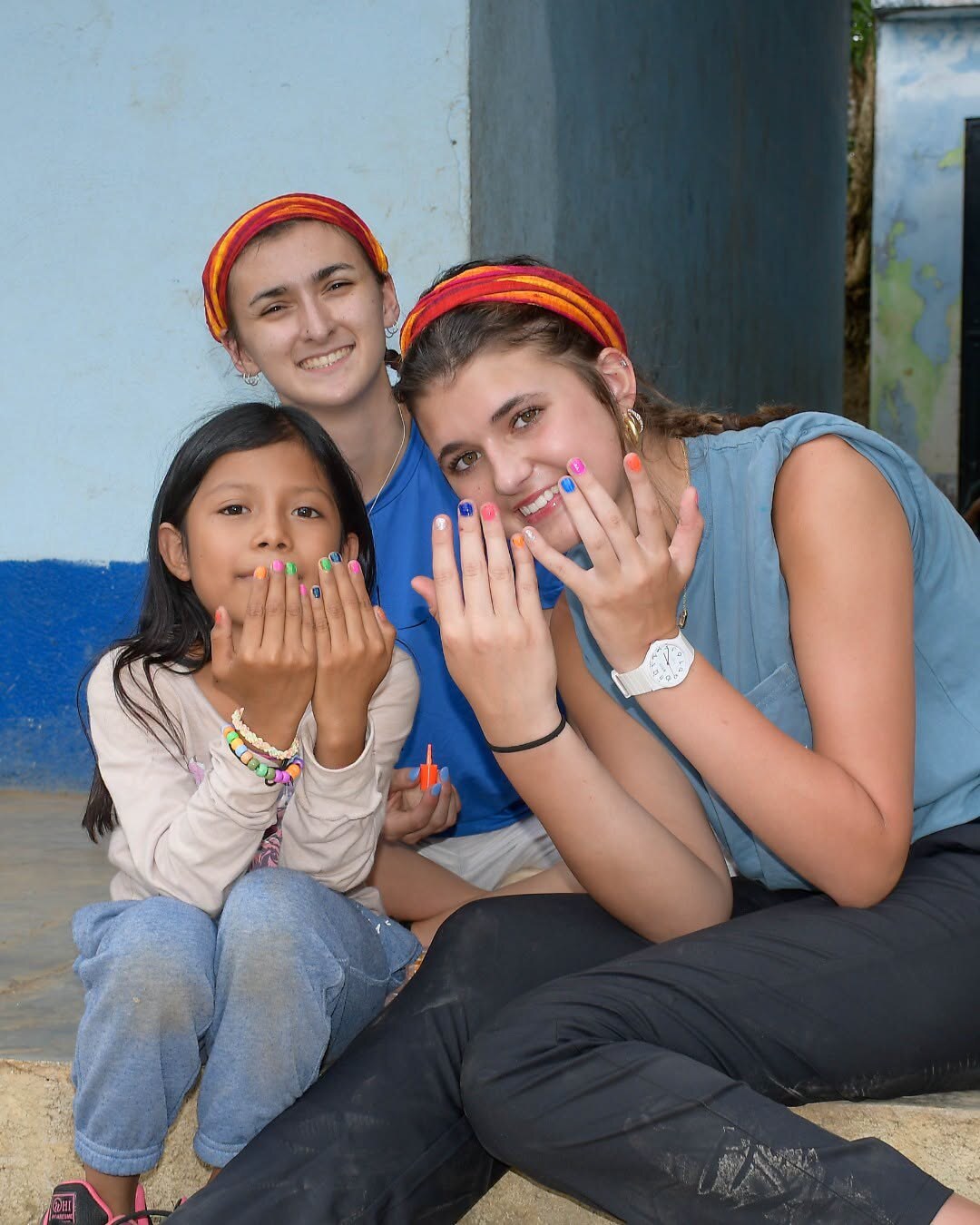 Wesleyan students serving a child during an international mission trip